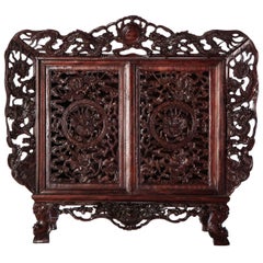 Used A Chinese  small openwork wood cabinet depicting Dragons