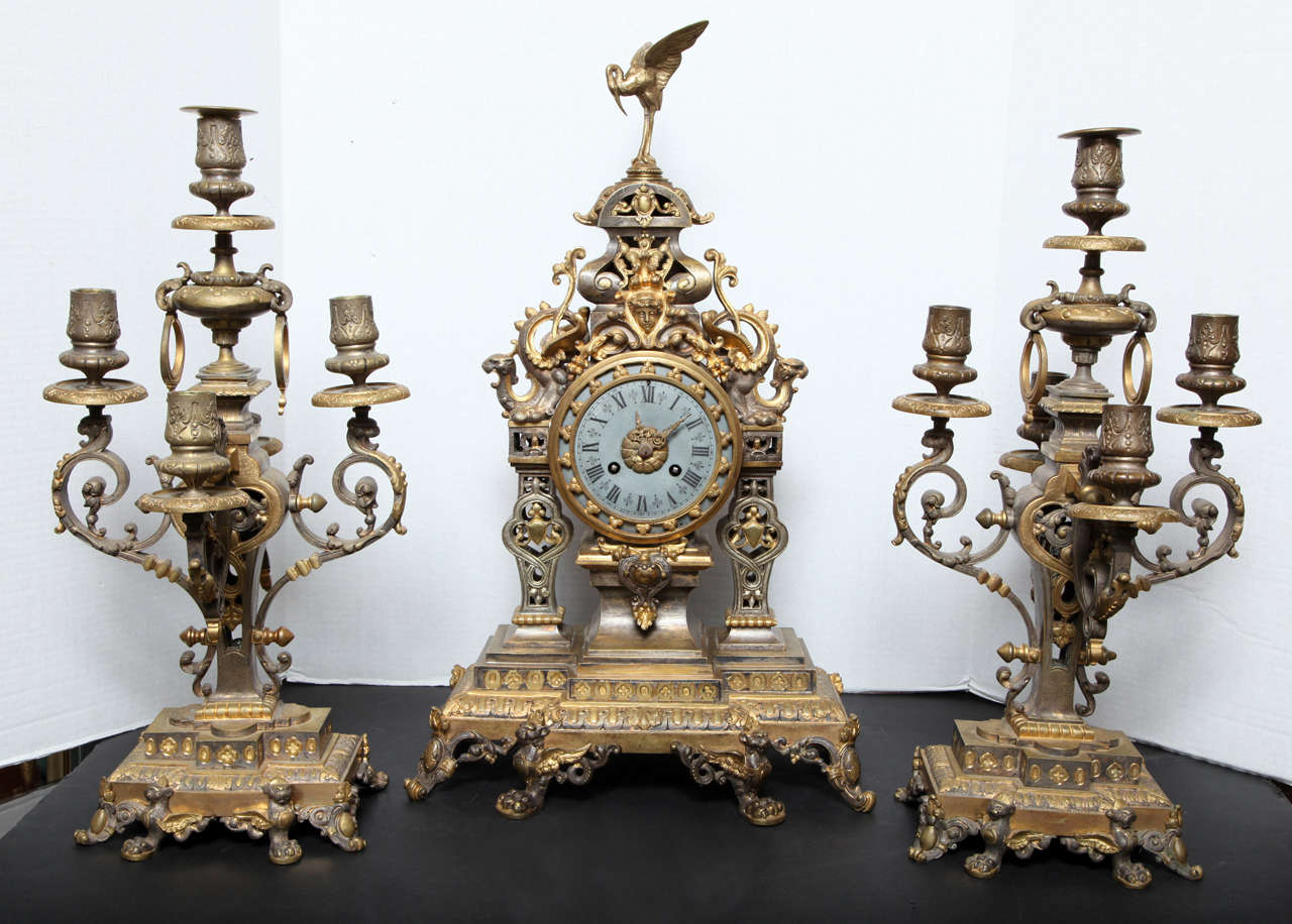 A very fine quality two toned silvered and gilt bronze three-piece chinoiserie style clock set. Candelabras measure 19 inches high by 10 inches deep. The back of the movement is signed E.B.
Stock number: CC60.