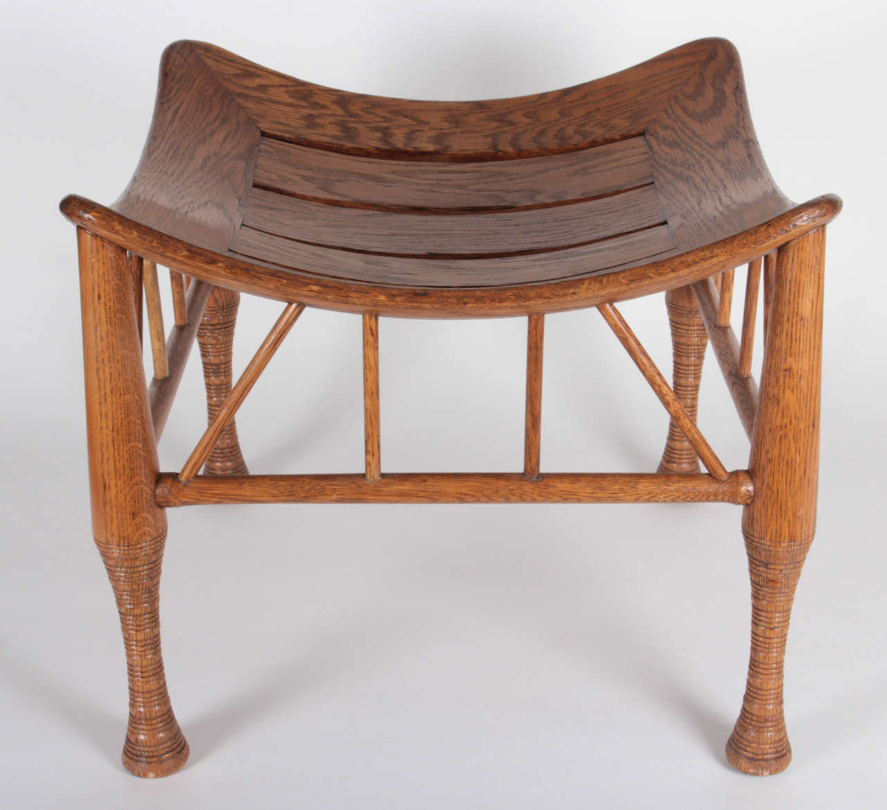 British Liberty & Co. /Leonard Wyburd Egyptian Revival Oak Thebes Stool, circa 1890-1895 For Sale