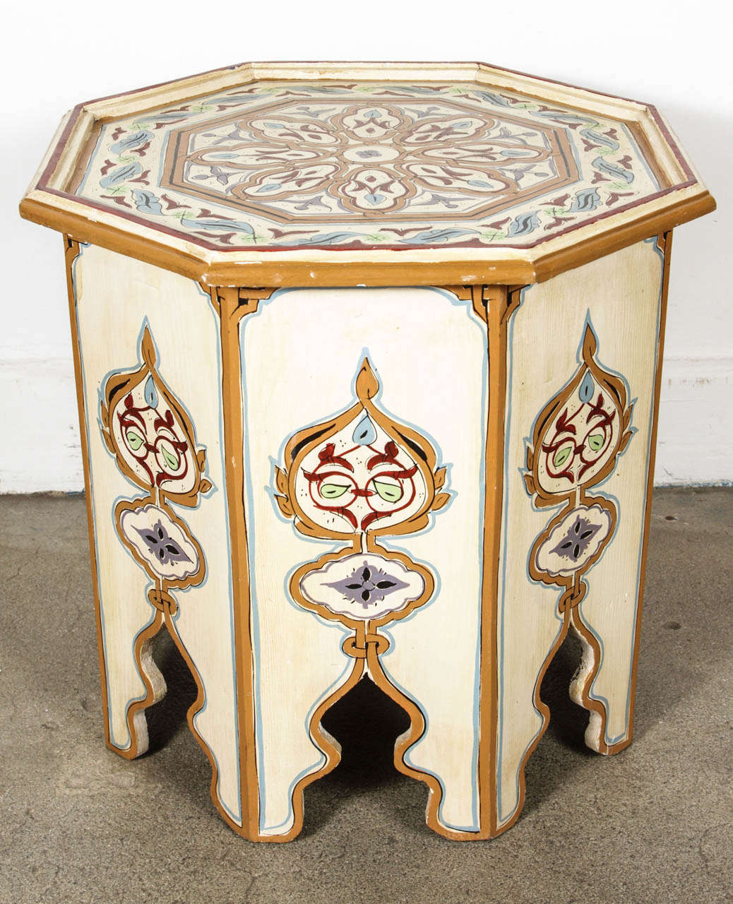 Moroccan colorful hand-painted side table with Moorish design. White background with multicolored floral and geometric designs. Very fine artwork on an octagonal shape base. You can use them as night stand or side table. This exotic side tables from