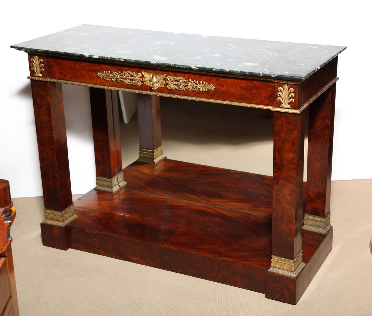 Early 19th Century French Empire,Mahogany,Ormolu Mounted, Neo-Classical, Marble Top Console, possibly having had a back splash, Ex Collection of the Guinness Family
The rectangular Verde Antico marble top with undercut edge over a single apron