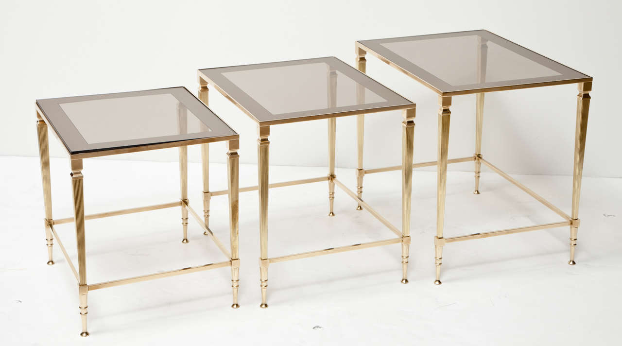 Neoclassical design on decorative nesting tables, circa 1950, Italy.
Measures: Large table is L 19, W 14, H 17.25. Middle size table is L 17.25, W 13.75, H 16. The small table is L 15.5, W 13.25, H 15.25.