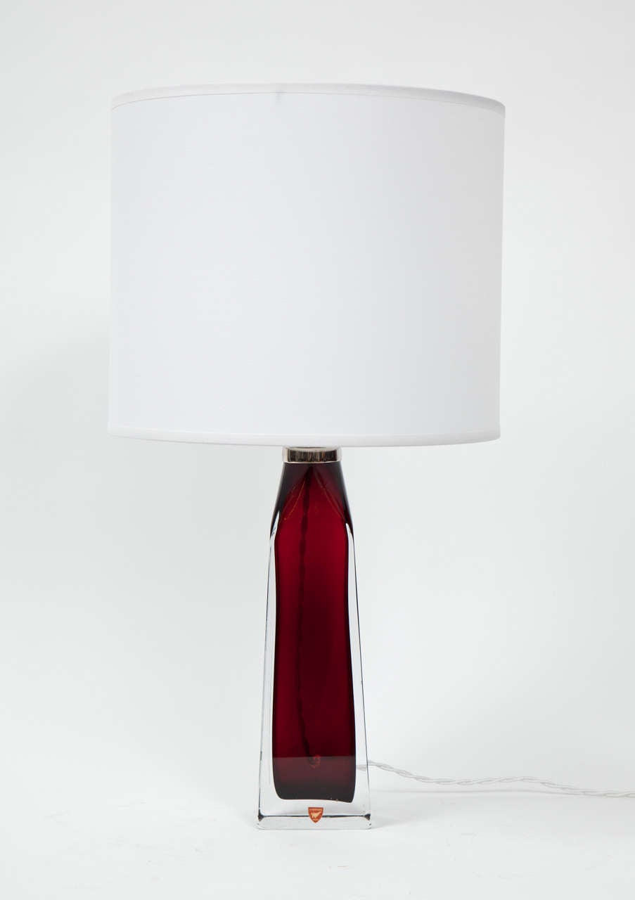 A stunning pair of garnet red lamps made by Orrefors, rewired for use in the U.S.