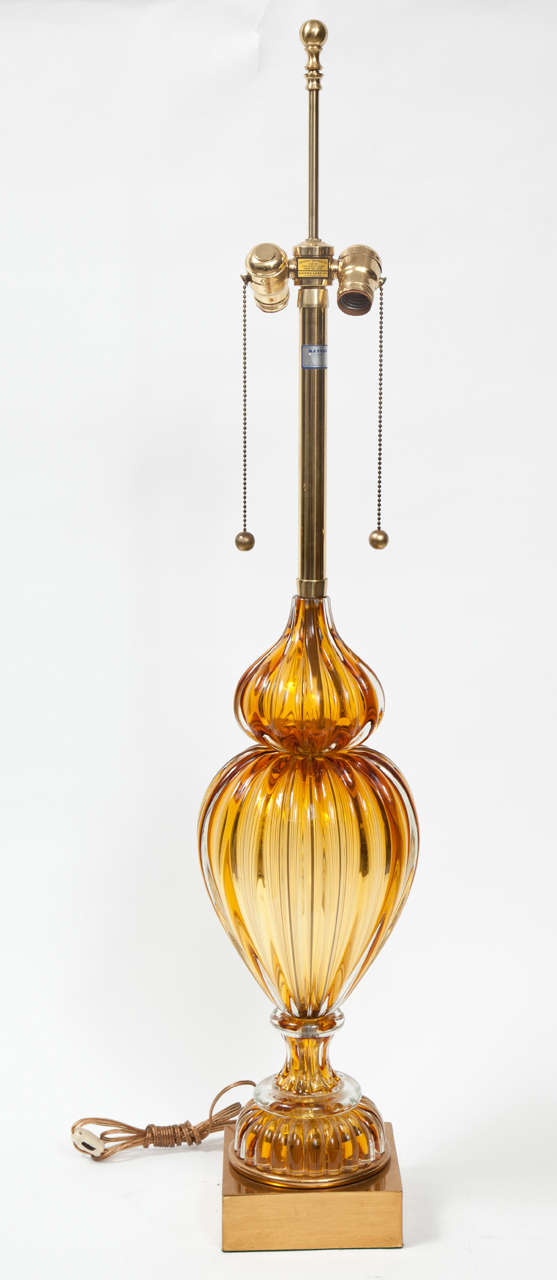 A pair of Murano glass lamps made by Marbro in a beautiful cognac color. The lamps have original Marbro label and brass base.