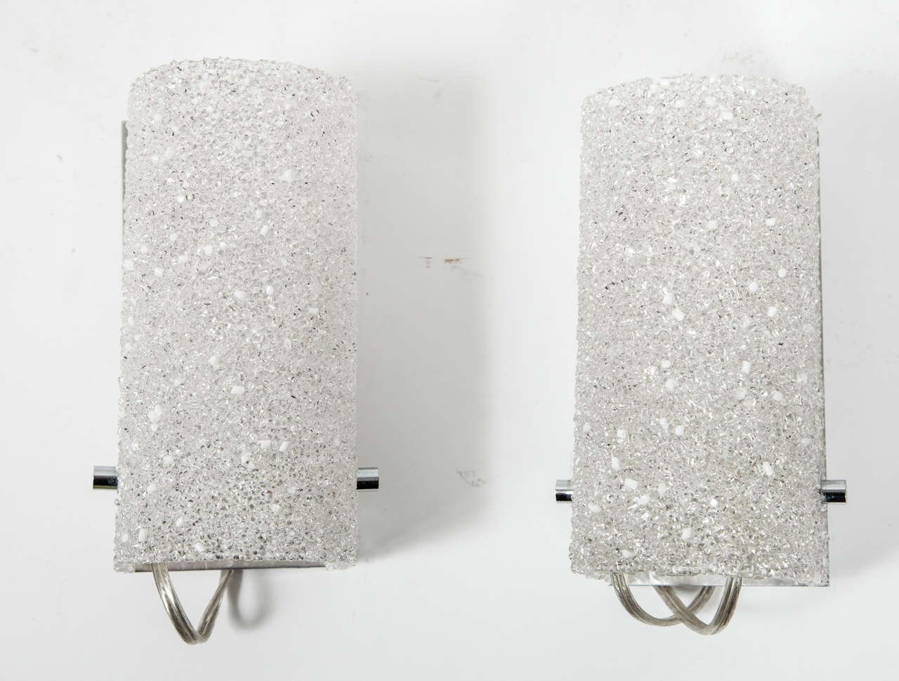 A glamorous pair of small sconces made up of tiny acrylic 