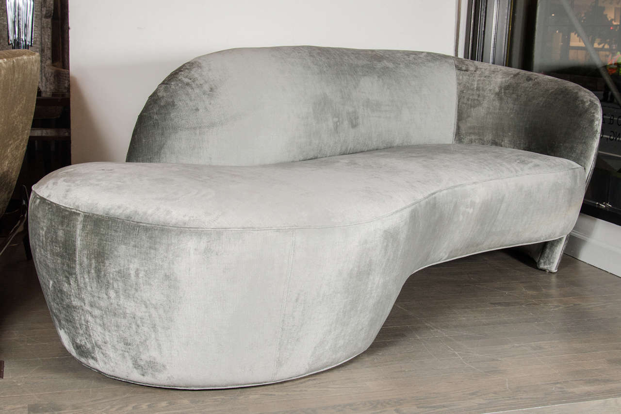 This outstanding Mid-Century Modern Kagan Style Sofa by Weiman Preview features an elegant organic form, the back wraps around the base creating a niche at one end of the sofa and an open seating space at the other end. The base is a cut-out design