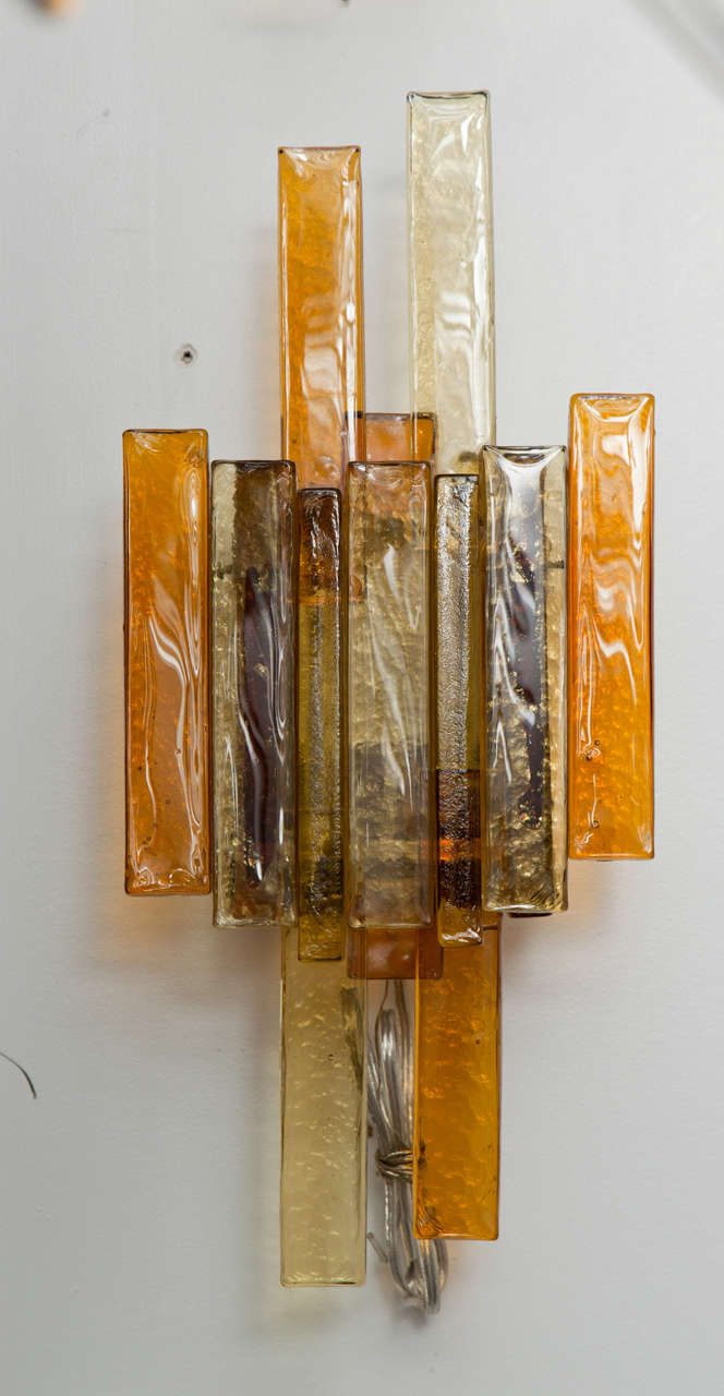Fantastic pair of stacked rectangular glass sconces in tones of amber and smokey topaz.