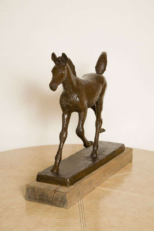 Galloping bronze foal mounted on a wood base by well listed Norwegian sculptor Skule Waksvic. Signed and dated 1979.