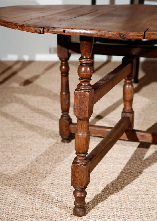Great walnut top table with original finish somewhat bleached. Great as end table or as 