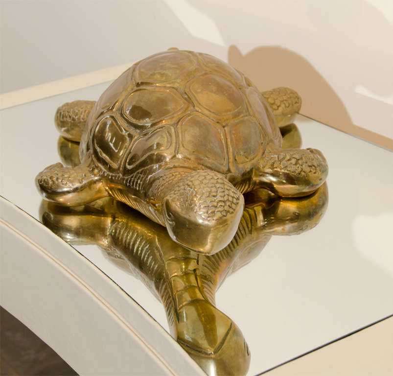 This large decorative brass turtle which is extremely heavy has beautiful detailing to its back, head and underside.