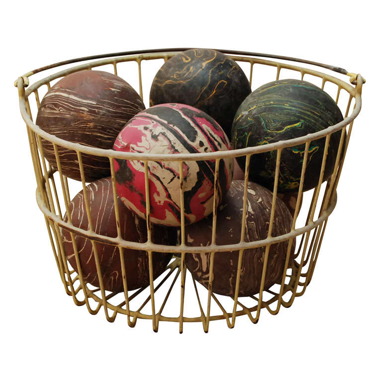 A Basket Full of Marblized Bowling Balls For Sale