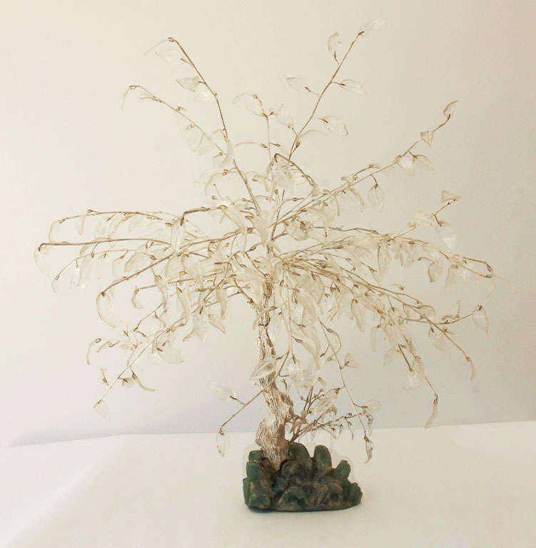 A charming decorative hardstone tree with carved rock crystal leaves and jadeite base.  A beautiful example of this type of work, the rock crystal leaves make this a true statement piece.