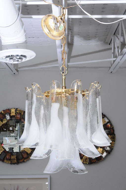 A somewhat smaller, 3-tiered version of our favorite Mazzega chandelier. Individually hand-blown, clear Murano glass petals are accented with a shock of white. Perfectly sized for a smaller entry foyer, breakfast nook, or master bath. Fixture is