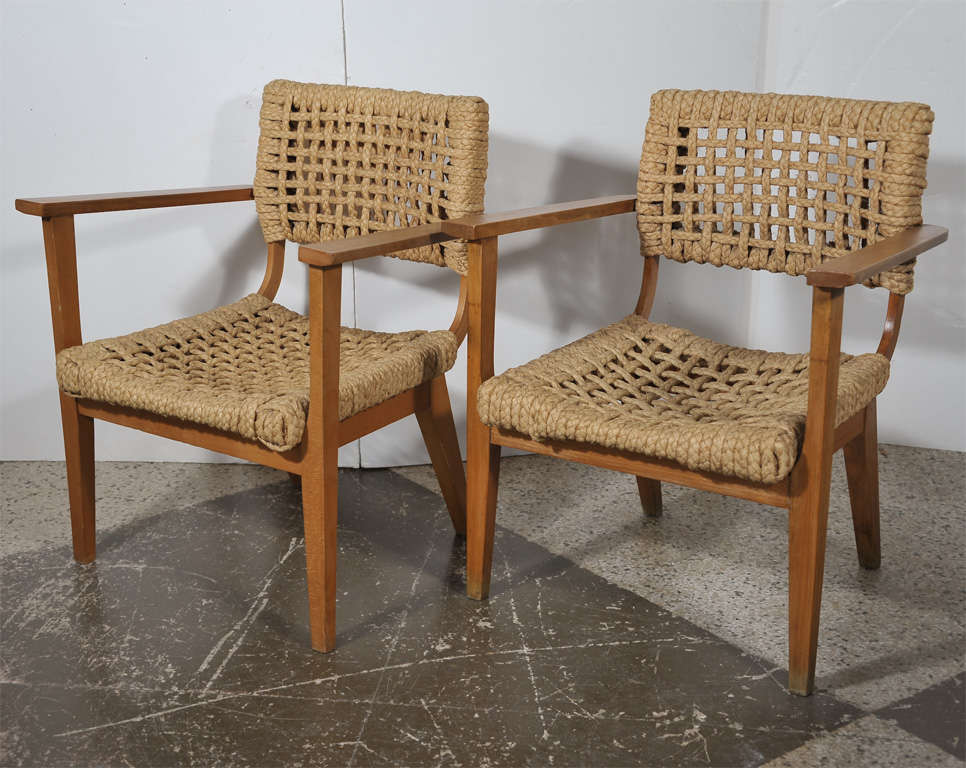 Braided flat rope armchairs with beech frame from Marseille. Designed by
Audoux-Minnet. In addition to this pair, we have a single chair available at $900. each.