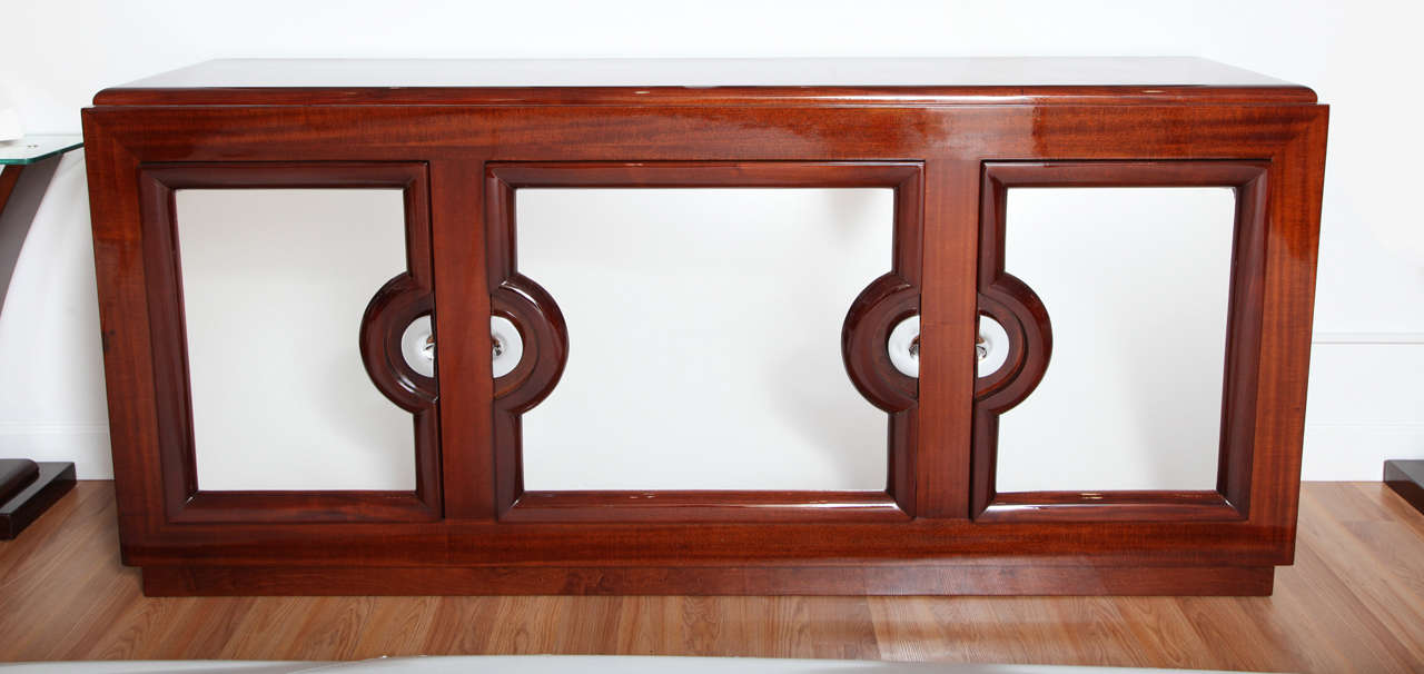 Art Deco Machine Age style three-door sideboard with polished chrome doors.