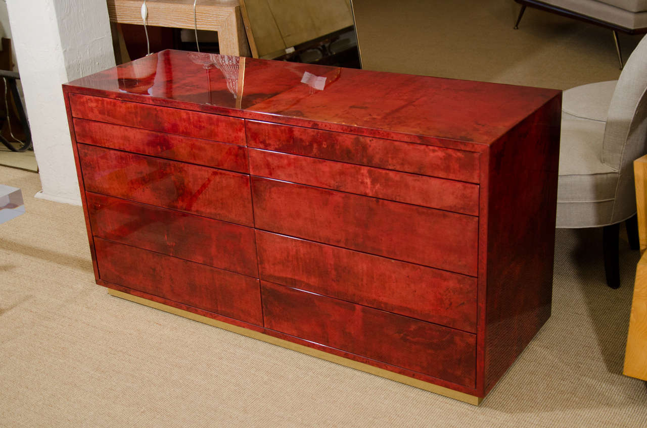 Aldo Tura red parchment commode with ten drawers.
