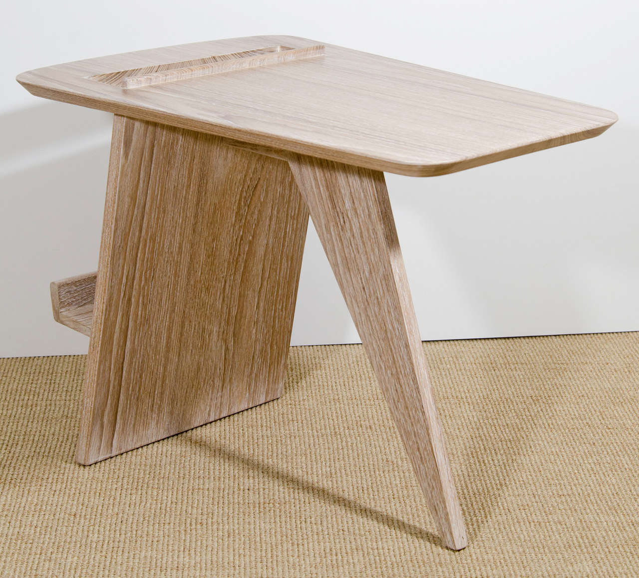 A cerused rosewood Mid-Century style magazine table.