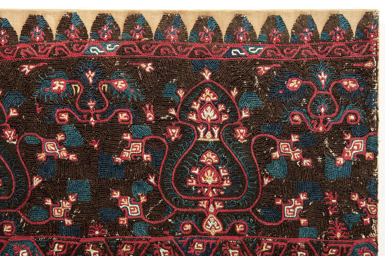 A very finely embroidered silk textile, richly decorated by Ottoman style motifs. Mounted on a wooden stretcher.