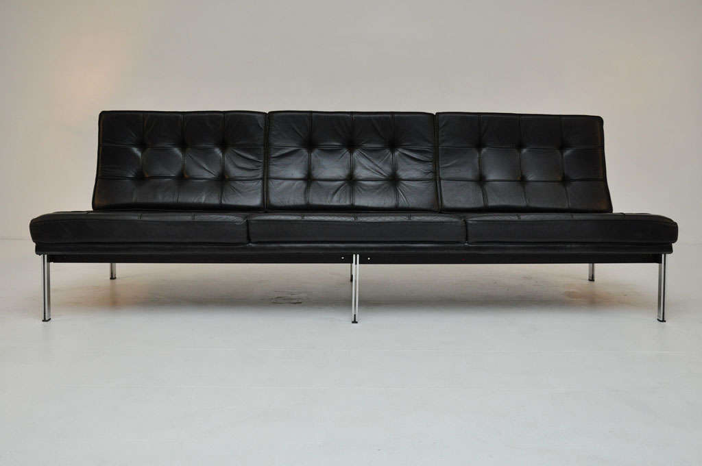 Classic Parallel Bar sofa by Florence Knoll.  Original black leather on chrome and metal frame.