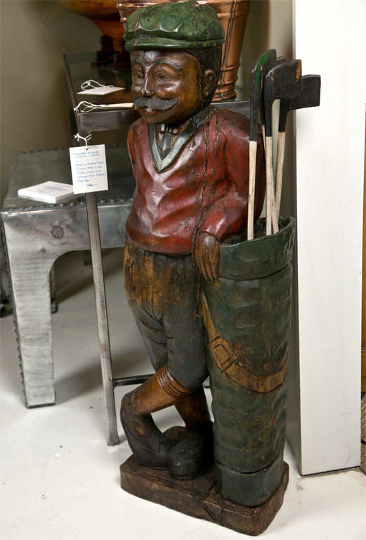 wooden golfer statue