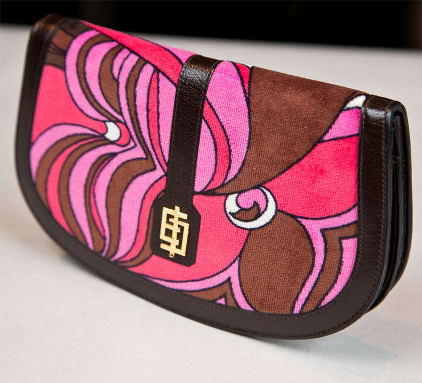 funkyfinders shares this never used crescent-shape clutch wallet from the house of pucci. it features a signature pucci print, unusual 'EP' logo center accent, dark brown leather trim, and an opulent velvet surround. the signed 'emilio pucci' 'made