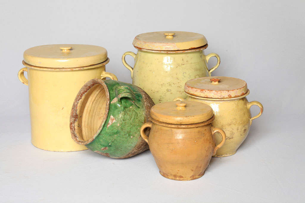 small glazed terracotta urns used in the french old Provencal kitchen, rare to find and searched for are these four jars with their lids and the green glazed jar without lid, smallest jar is 
20cm high, 18cm diameter