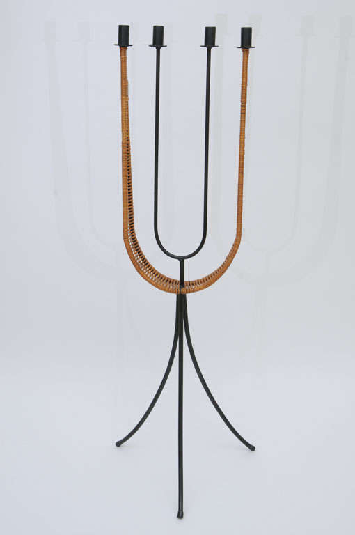 In his unmistakable panache and style, Arthur Umanoff created this standing candelabra in black wrought iron and a woven wrapping of rattan cane for Raymor. Great scale, it commands attention and makes a great finishing accessory to any room.
In