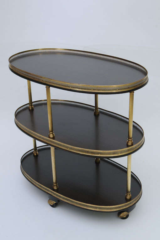 SOLD Tea Cart, Bar Cart or Dessert Cart.  This ebonized three tier cart on casters with a reticulated brass gallery on each level and heavy brass reeded column supports is exceptional, elegant and very well made.  Spanning the design periods, it is