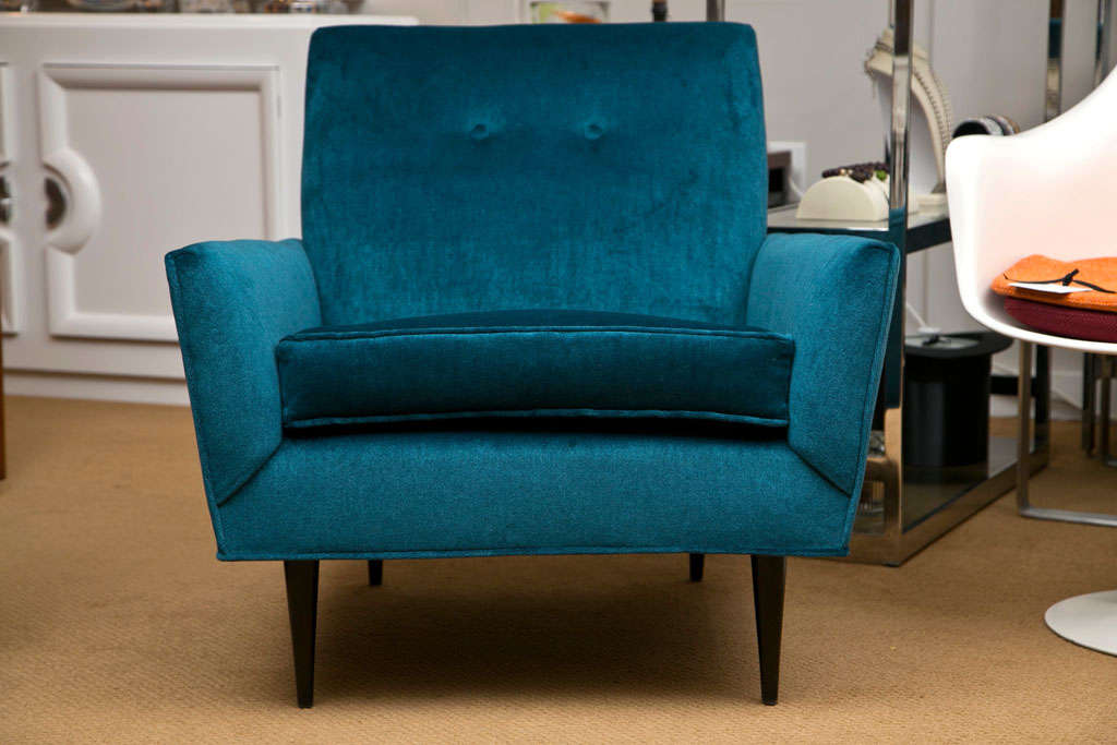 Classic mid-century armchair with button back. Small in scale, big in comfort. Dark stained legs with teal mohair velvet prized for it's strength, durability and lustre. 
The fibers take to color in a way that produces a translucent effect unique