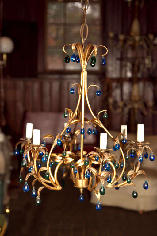 Six-arm Italian gilt metal chandelier with small blue and green crystal drops.