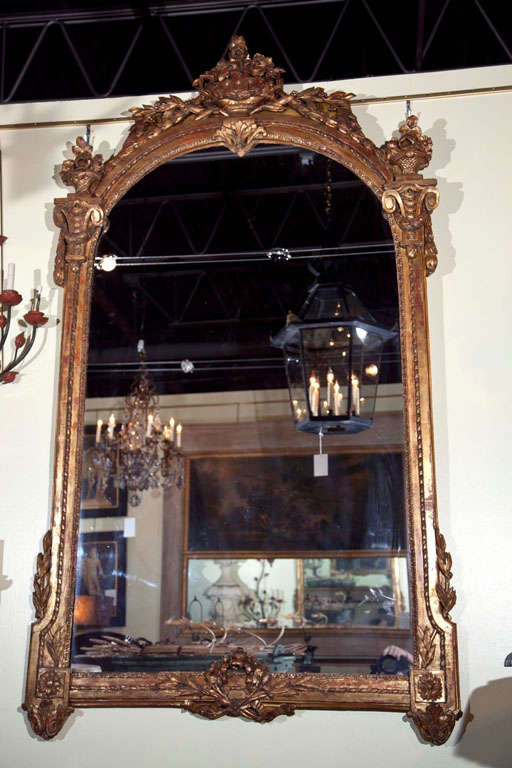 A magnificent, palatial size, carved & gilt Italian framed mirror with basket, floral, wreath and swag motif.  Mirror itself has been replaced.