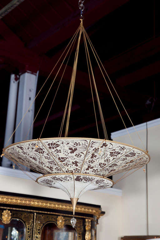 Fortuny two tier brown floral light fixture. The height can be shortened by adjusting the pulls.