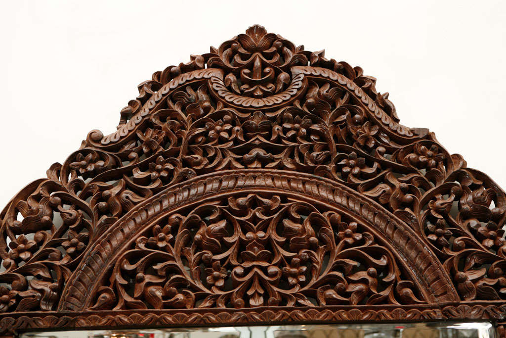 9'8 Giant Anglo Indian Mirror.
Mogul era heavily and finely hand- carved with floral design, amazing craftsmanship on frame mirror.
Taj Mahal Style, Rajhastani work on wood.

Mosaik provides Antiques,Art Deco, Moorish Style, Spanish, African,