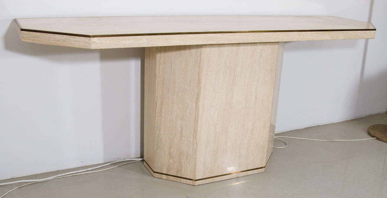 A Willy Rizzo inspired design, this travertine console table would make a wonderful entry way table for a modern statement.