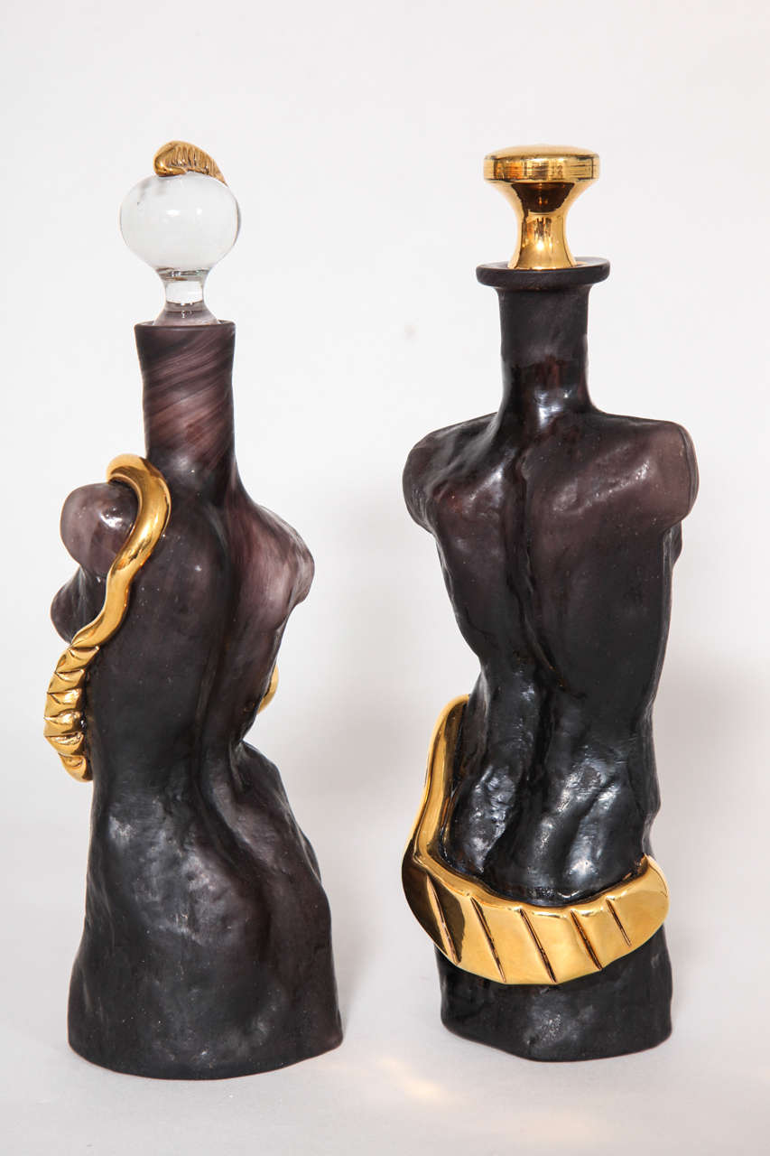 European Black 'Amethyst' Glass with Gold Surrealist Figurative Cologne Bottles