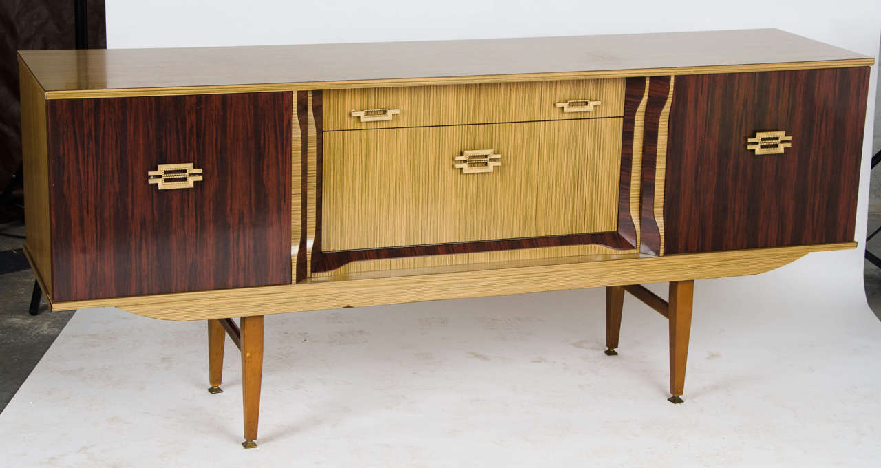 A 1960s unusual style laminated faux wood veneer sideboard.