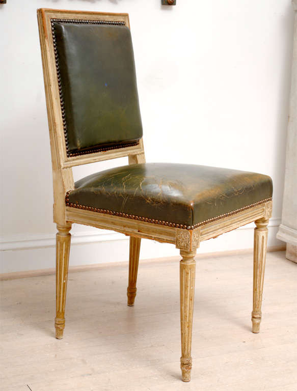 Set of 8 square back painted Louis XVI style dining chairs with green leather seats.