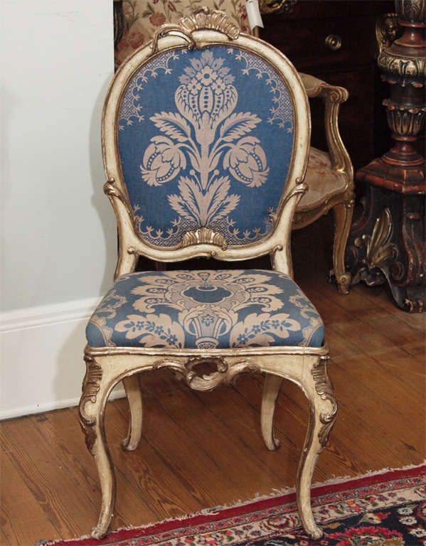 Exceptional set of Eight Parcel Gilt and Painted 18th century Venetian Side Chairs. Upholstered in Lyonaise Silk