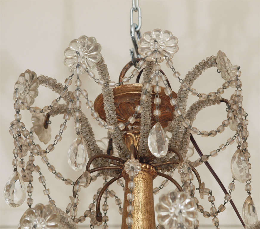 18TH C. Genovese Gilt wood stemmed iron arm crystal draped chandelier.