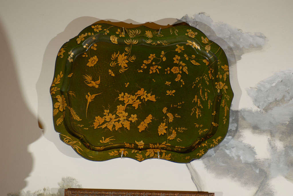 Scalloped edge paper mache tray.  Green background with painted and gilded japanned birds and floral designs.