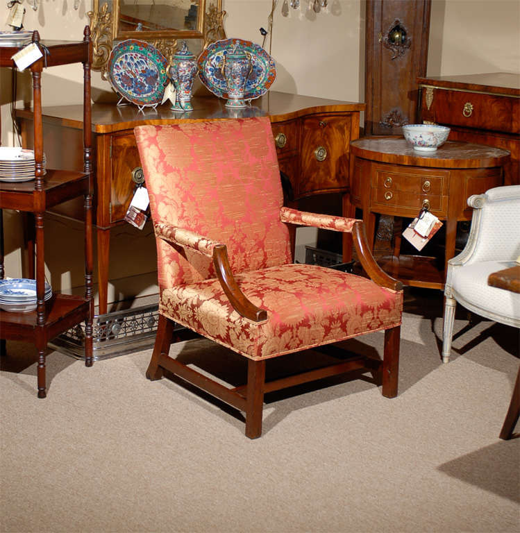A George III mahogany library chair with rectangular back, curved arms and stretcher below. 

For many more fine antiques, please visit our online gallery.
William Word Fine Antiques: Atlanta's source for antique interiors since 1956.