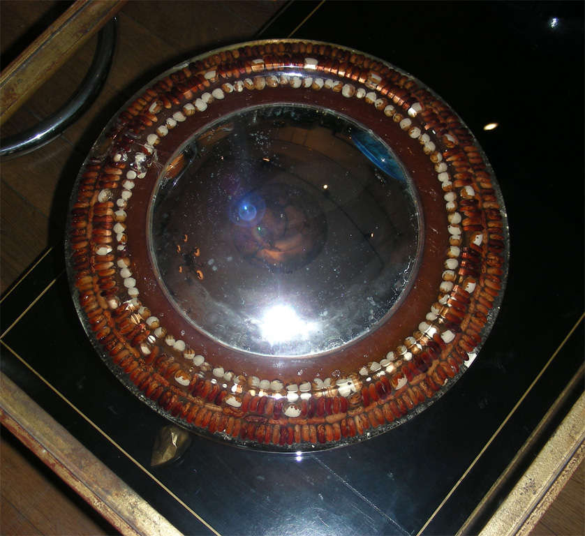 1970s convex mirror by Pierre Giraudon, in resin incorporating grains; comes from the family of Pierre Giraudon.