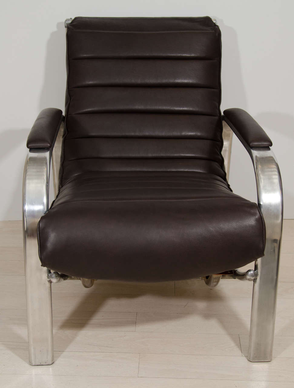 Pair of polished aluminum easy chairs by Christie Tyler with newly upholstered brown leather 
