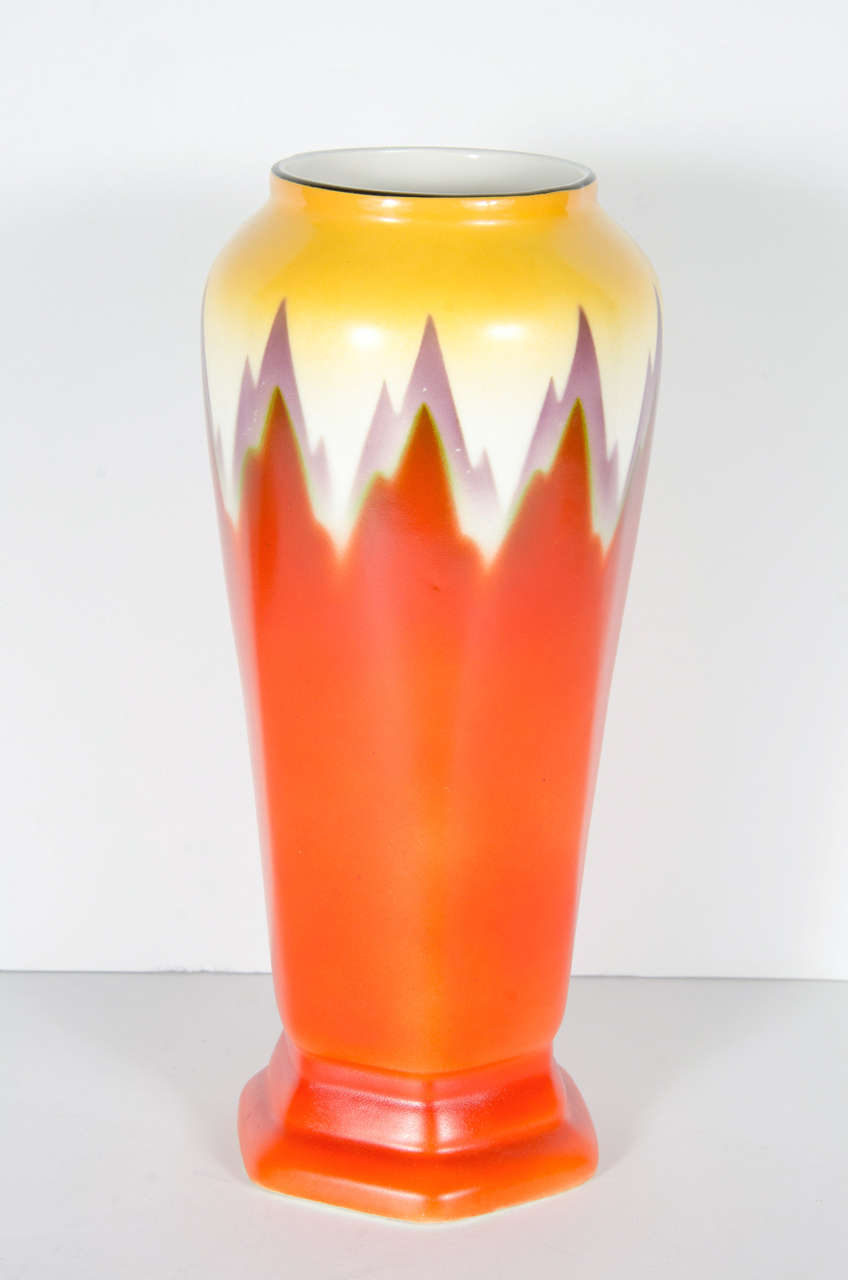 Art Deco vase by Ditmar Urbach from Czechoslovakia, Circa 1930. Hand-painted with hues of red, purple and yellow giving it it's skyscraper flame design.