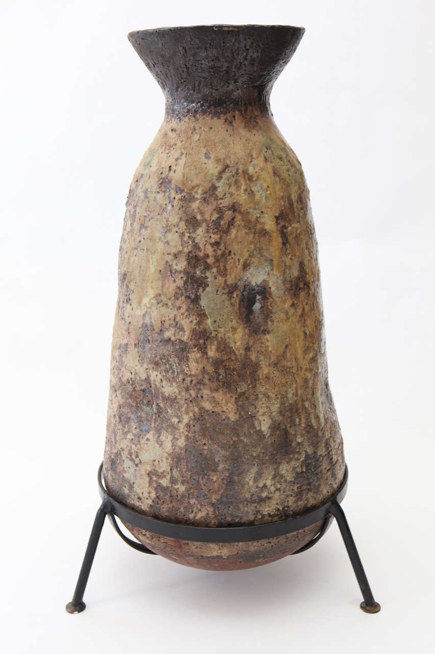 One of a kind earthenware vase from West Germany.  Original rough iron base is 5.5