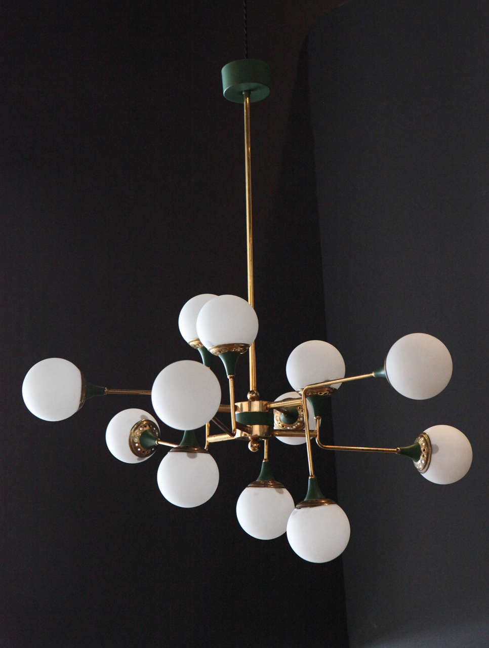 An original Stilnovo twelve globe chandelier, has been rewired for safety.