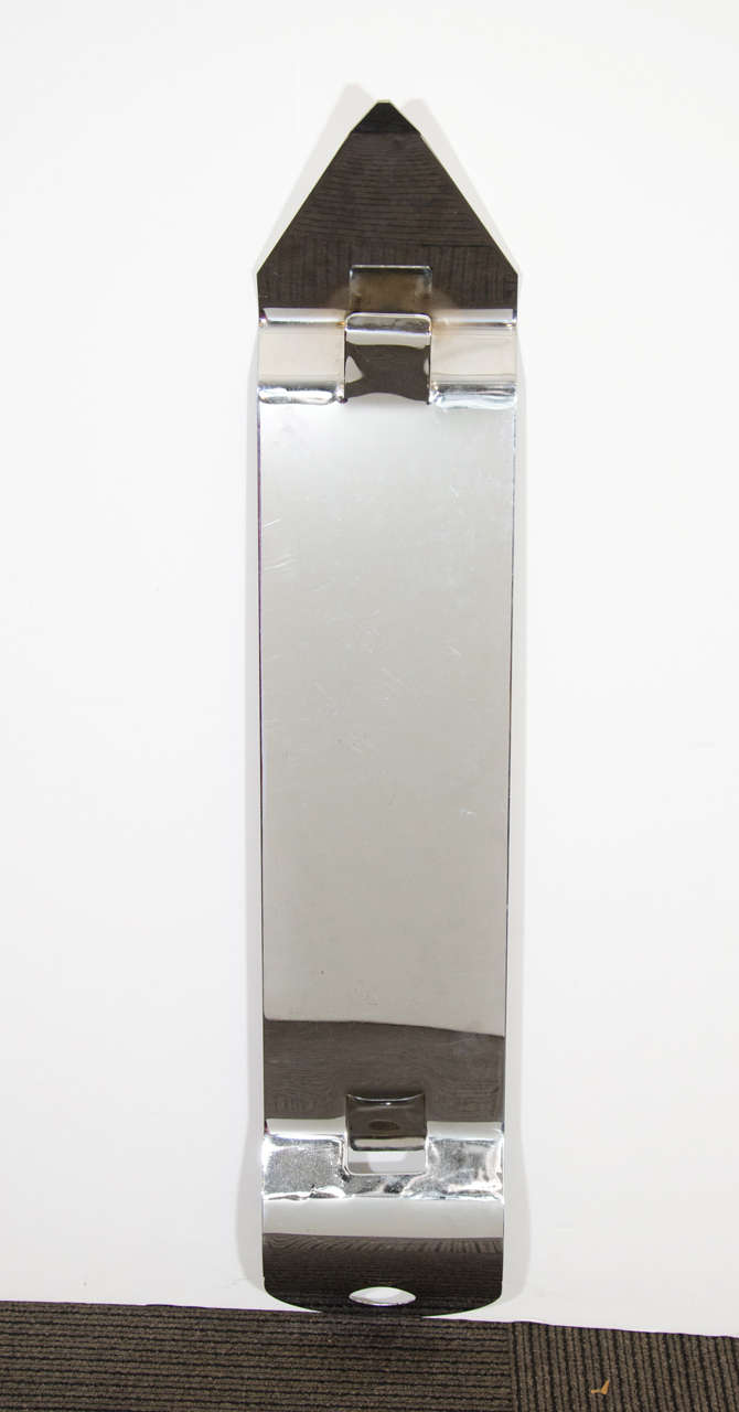 A Pop art Curtis Jere wall-mounted polished nickel can opener sculpture.