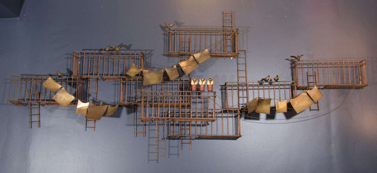A vintage monumental abstract style wall sculpture of a New York City fire escape scene with pigeons, flower pots, and hanging laundry signed C. Jere.