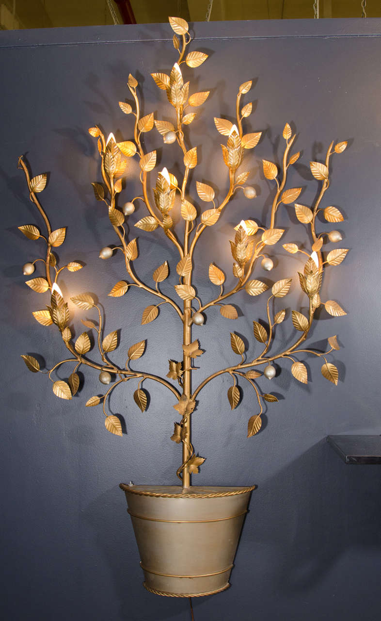 A Well Constructed 1940s Italian enameled tole wall hanging or wall-mounted sculpture of a lemon tree mounted in a silver pot. There are seven Candelabra Base lights