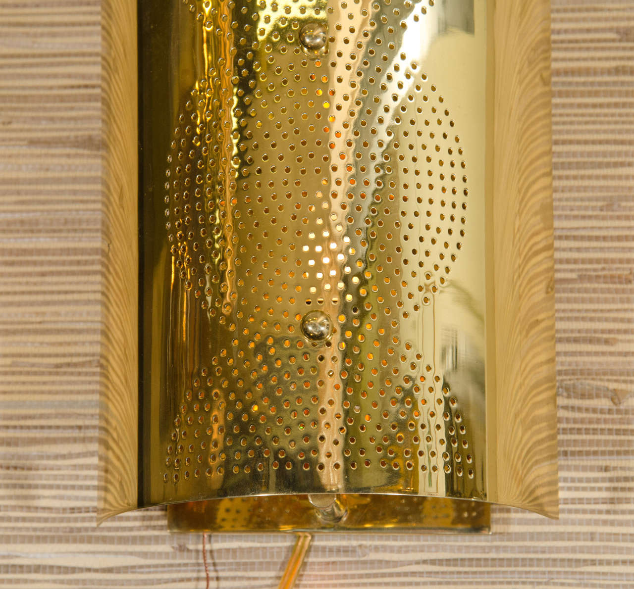 perforated wall sconce